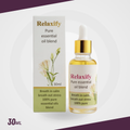 Relaxify essential oil bottle and packaging on a green and beige background with dried herbs and flowers.