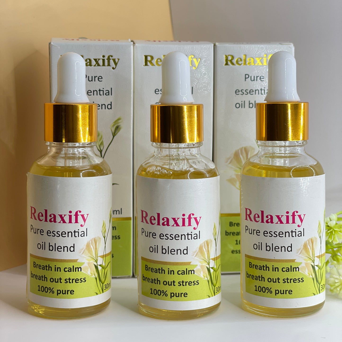 Relaxify pure essential oil blend bottles with boxes on a light background